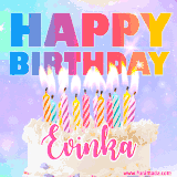 A vibrant animated name GIF with the words 'Happy Birthday Evinka' with colorful candles on a creamy cake. The background sparkles with pastel shades, adding a festive touch.