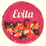 Beautifully decorated red velvet berry birthday cake with vibrant fruits and a glowing 'Evita' name, adding a touch of sweetness and sparkle.