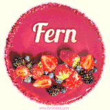 Beautifully decorated red velvet berry birthday cake with vibrant fruits and a glowing 'Fern' name, adding a touch of sweetness and sparkle.