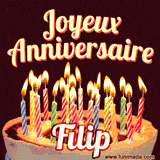 A Happy Birthday GIF in French featuring a festive birthday cake adorned with bright candles and the glowing text 'Joyeux Anniversaire Filip' in a cheerful style.