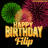 A captivating GIF with bursts of green, pink, and orange fireworks lighting up the night sky, accompanied by 'Happy Birthday Filip' in glowing golden text.