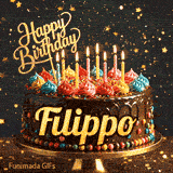 A decorated birthday cake with colorful frosting rosettes, glowing candles, and a golden Happy Birthday topper with the name Filippo.
