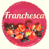 Beautifully decorated red velvet berry birthday cake with vibrant fruits and a glowing 'Franchesca' name, adding a touch of sweetness and sparkle.