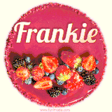 Beautifully decorated red velvet berry birthday cake with vibrant fruits and a glowing 'Frankie' name, adding a touch of sweetness and sparkle.