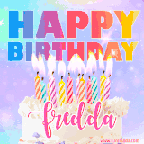 A vibrant animated name GIF with the words 'Happy Birthday Fredda' with colorful candles on a creamy cake. The background sparkles with pastel shades, adding a festive touch.