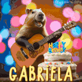 Animated birthday GIF showing a capybara playing guitar and singing beside a birthday cake with the name Gabriela in large letters and colorful bokeh lights in the background.