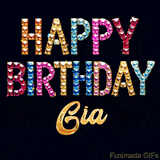Vibrant luxury birthday greeting card for Gia, showing glittering gemstone letters and golden calligraphy on a dark background with twinkling shine effects.