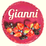 Beautifully decorated red velvet berry birthday cake with vibrant fruits and a glowing 'Gianni' name, adding a touch of sweetness and sparkle.