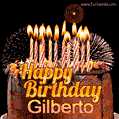 A rich chocolate cake topped with glowing birthday candles and surrounded by bright fireworks. The animated GIF displays the message 'Happy Birthday Gilberto' in golden text.