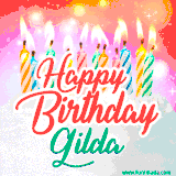 Bright birthday candles with rainbow flames on a cake, alongside the text 'Happy Birthday Gilda' in vibrant script in this celebratory animated GIF.