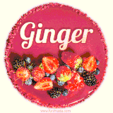 Beautifully decorated red velvet berry birthday cake with vibrant fruits and a glowing 'Ginger' name, adding a touch of sweetness and sparkle.