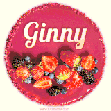 Beautifully decorated red velvet berry birthday cake with vibrant fruits and a glowing 'Ginny' name, adding a touch of sweetness and sparkle.