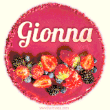 Beautifully decorated red velvet berry birthday cake with vibrant fruits and a glowing 'Gionna' name, adding a touch of sweetness and sparkle.