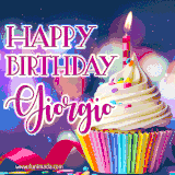 A festive animated GIF featuring a colorful cupcake with a single lit candle, sprinkles, and 'Happy Birthday Giorgio' text against a sparkling, celebratory background.