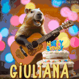 Animated birthday GIF showing a capybara playing guitar and singing beside a birthday cake with the name Giuliana in large letters and colorful bokeh lights in the background.