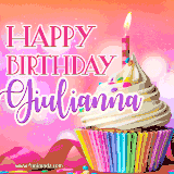 A vibrant birthday GIF featuring a rainbow-colored cupcake topped with white frosting, sprinkles, and a lit candle. The text reads 'Happy Birthday Giulianna' in bold pink and violet letters with white outline.