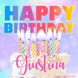 A vibrant animated name GIF with the words 'Happy Birthday Giustina' with colorful candles on a creamy cake. The background sparkles with pastel shades, adding a festive touch.