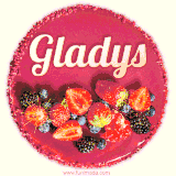 Beautifully decorated red velvet berry birthday cake with vibrant fruits and a glowing 'Gladys' name, adding a touch of sweetness and sparkle.