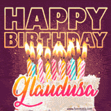 A colorful birthday cake topped with lit candles, with the words 'Happy Birthday Glaudusa' in bold glowing letters on a burgundy background. Animated flames add a festive touch.