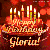 Beautifully decorated red velvet berry birthday cake with vibrant fruits and a glowing 'Gloria' name, adding a touch of sweetness and sparkle.