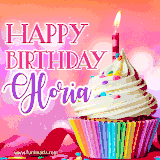 A vibrant birthday GIF featuring a rainbow-colored cupcake topped with white frosting, sprinkles, and a lit candle. The text reads 'Happy Birthday Gloria' in bold pink and violet letters with white outline.