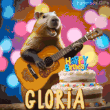 Animated birthday GIF showing a capybara playing guitar and singing beside a birthday cake with the name Gloria in large letters and colorful bokeh lights in the background.