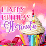 A vibrant birthday GIF featuring a rainbow-colored cupcake topped with white frosting, sprinkles, and a lit candle. The text reads 'Happy Birthday Glorinda' in bold pink and violet letters with white outline.