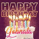 A colorful birthday cake topped with lit candles, with the words 'Happy Birthday Gobnata' in bold glowing letters on a burgundy background. Animated flames add a festive touch.
