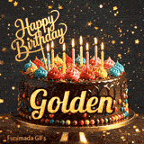 Gold Happy Birthday topper and bright burning candles on a chocolate frosted cake with the name Golden.