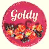Beautifully decorated red velvet berry birthday cake with vibrant fruits and a glowing 'Goldy' name, adding a touch of sweetness and sparkle.