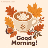 White ceramic cup with maple leaf latte art and rising steam sits among orange and brown autumn leaves a ripe fig red berries and an acorn while bold brown Good Morning lettering appears below on a soft beige background