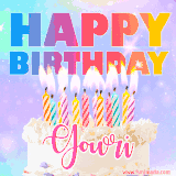 A vibrant animated name GIF with the words 'Happy Birthday Gowri' with colorful candles on a creamy cake. The background sparkles with pastel shades, adding a festive touch.
