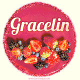 Beautifully decorated red velvet berry birthday cake with vibrant fruits and a glowing 'Gracelin' name, adding a touch of sweetness and sparkle.