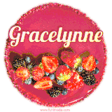 Beautifully decorated red velvet berry birthday cake with vibrant fruits and a glowing 'Gracelynne' name, adding a touch of sweetness and sparkle.