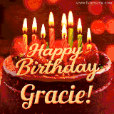 Beautifully decorated red velvet berry birthday cake with vibrant fruits and a glowing 'Gracie' name, adding a touch of sweetness and sparkle.