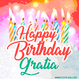 Bright birthday candles with rainbow flames on a cake, alongside the text 'Happy Birthday Gratia' in vibrant script in this celebratory animated GIF.