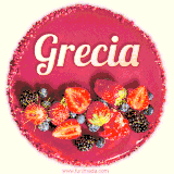 Beautifully decorated red velvet berry birthday cake with vibrant fruits and a glowing 'Grecia' name, adding a touch of sweetness and sparkle.