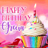 A vibrant birthday GIF featuring a rainbow-colored cupcake topped with white frosting, sprinkles, and a lit candle. The text reads 'Happy Birthday Grecia' in bold pink and violet letters with white outline.