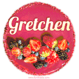 Beautifully decorated red velvet berry birthday cake with vibrant fruits and a glowing 'Gretchen' name, adding a touch of sweetness and sparkle.