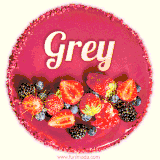 Beautifully decorated red velvet berry birthday cake with vibrant fruits and a glowing 'Grey' name, adding a touch of sweetness and sparkle.
