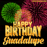 A captivating GIF with bursts of green, pink, and orange fireworks lighting up the night sky, accompanied by 'Happy Birthday Guadalupe' in glowing golden text.