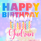 A vibrant animated name GIF with the words 'Happy Birthday Gudrun' with colorful candles on a creamy cake. The background sparkles with pastel shades, adding a festive touch.