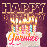 A colorful birthday cake topped with lit candles, with the words 'Happy Birthday Gurutze' in bold glowing letters on a burgundy background. Animated flames add a festive touch.