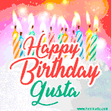 Bright birthday candles with rainbow flames on a cake, alongside the text 'Happy Birthday Gusta' in vibrant script in this celebratory animated GIF.