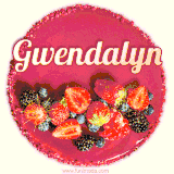 Beautifully decorated red velvet berry birthday cake with vibrant fruits and a glowing 'Gwendalyn' name, adding a touch of sweetness and sparkle.