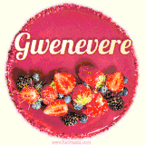 Beautifully decorated red velvet berry birthday cake with vibrant fruits and a glowing 'Gwenevere' name, adding a touch of sweetness and sparkle.