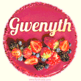 Beautifully decorated red velvet berry birthday cake with vibrant fruits and a glowing 'Gwenyth' name, adding a touch of sweetness and sparkle.