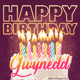 A colorful birthday cake topped with lit candles, with the words 'Happy Birthday Gwynedd' in bold glowing letters on a burgundy background. Animated flames add a festive touch.