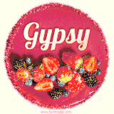 Beautifully decorated red velvet berry birthday cake with vibrant fruits and a glowing 'Gypsy' name, adding a touch of sweetness and sparkle.
