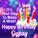 A colorful birthday GIF for Gypsy featuring a cupcake with vibrant lit candles and the text 'It's Your Day to Make a Wish! Happy Birthday Gypsy' in bold letters on a festive purple background.